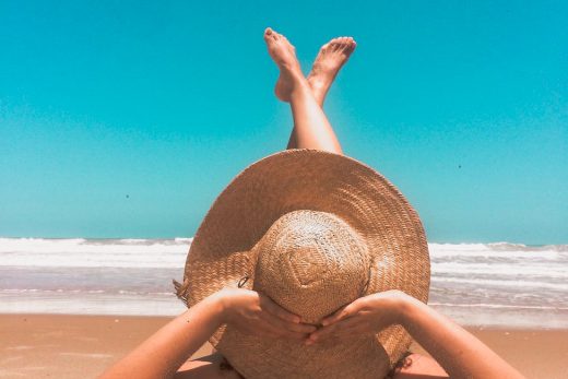 person laying on sand